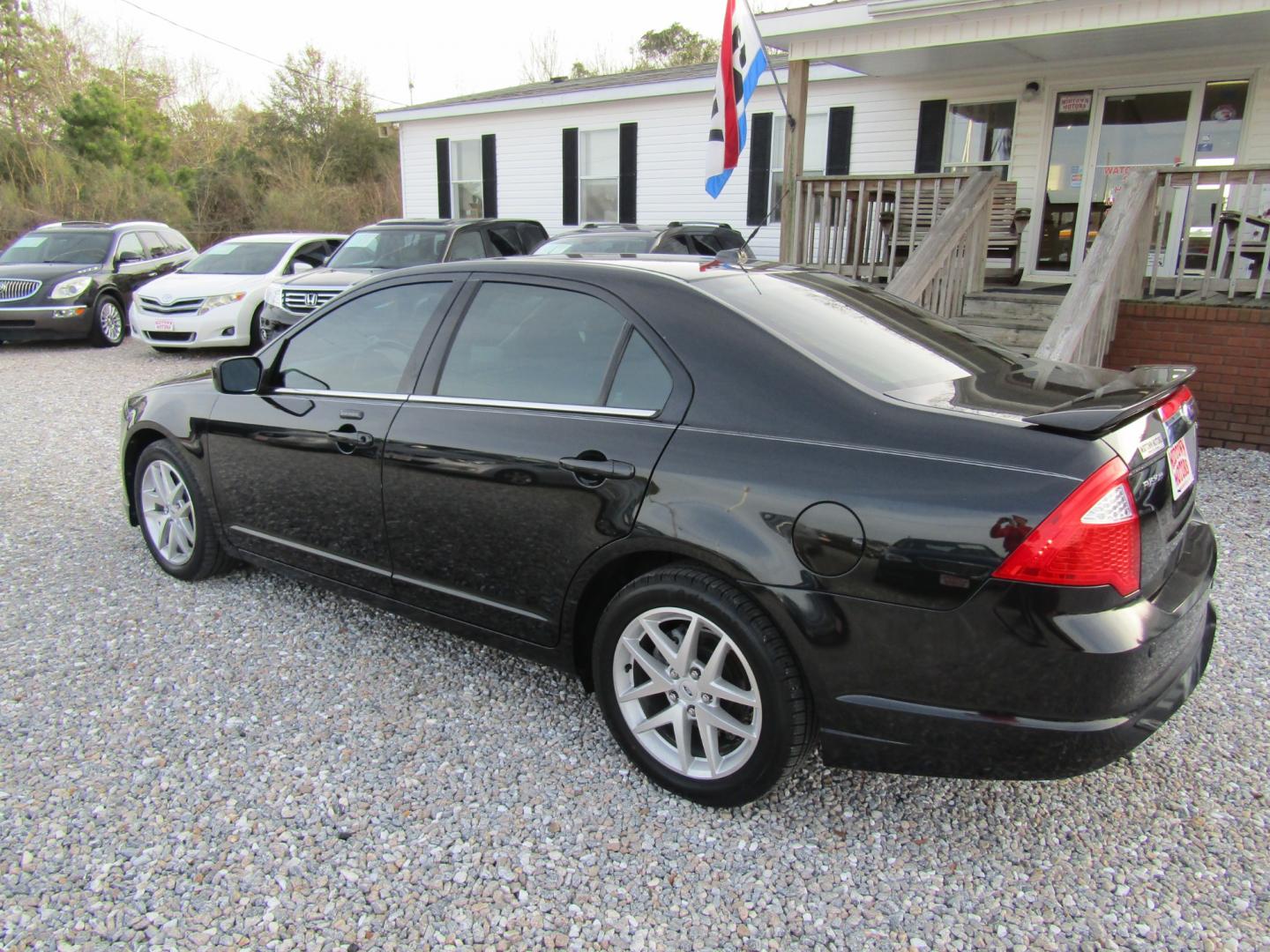 2011 Black /Tan Ford Fusion (3FAHP0JG4BR) , Automatic transmission, located at 15016 S Hwy 231, Midland City, AL, 36350, (334) 983-3001, 31.306210, -85.495277 - Photo#5